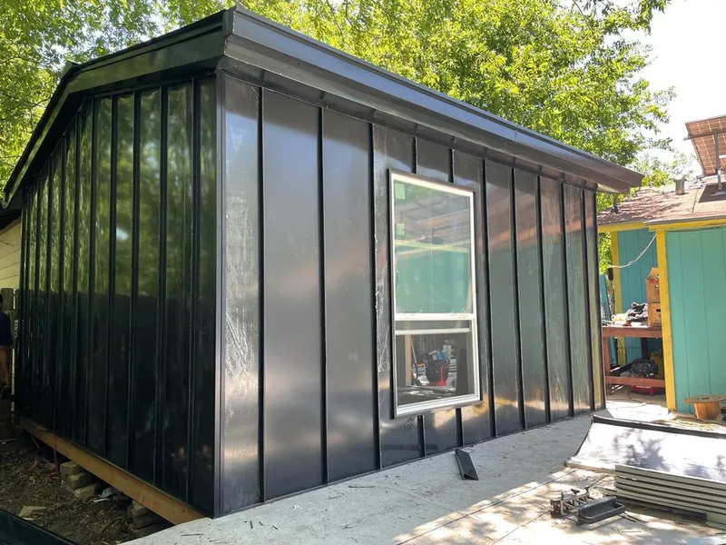 Black standing seam metal wall panels for Roof Inspection in Hanover Park